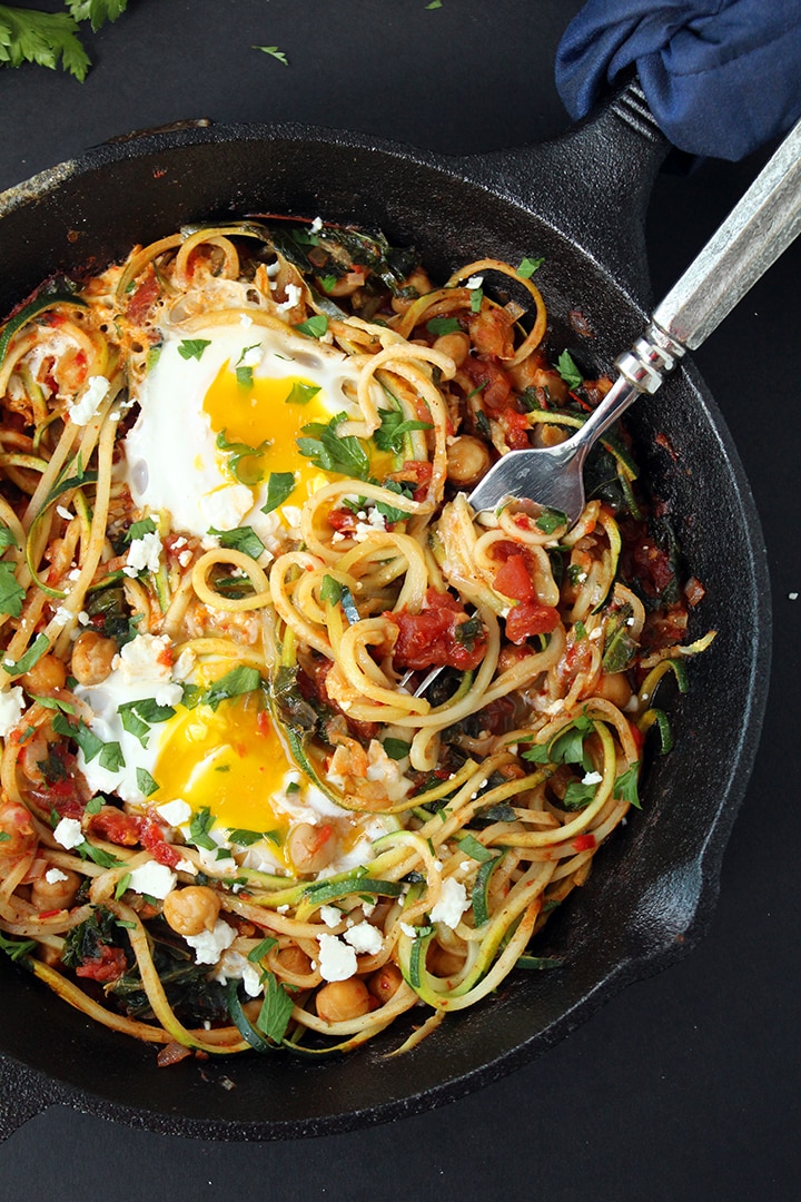 Harissa Zucchini Spaghetti Skillet with Kale, Chickpeas and Poached Eggs