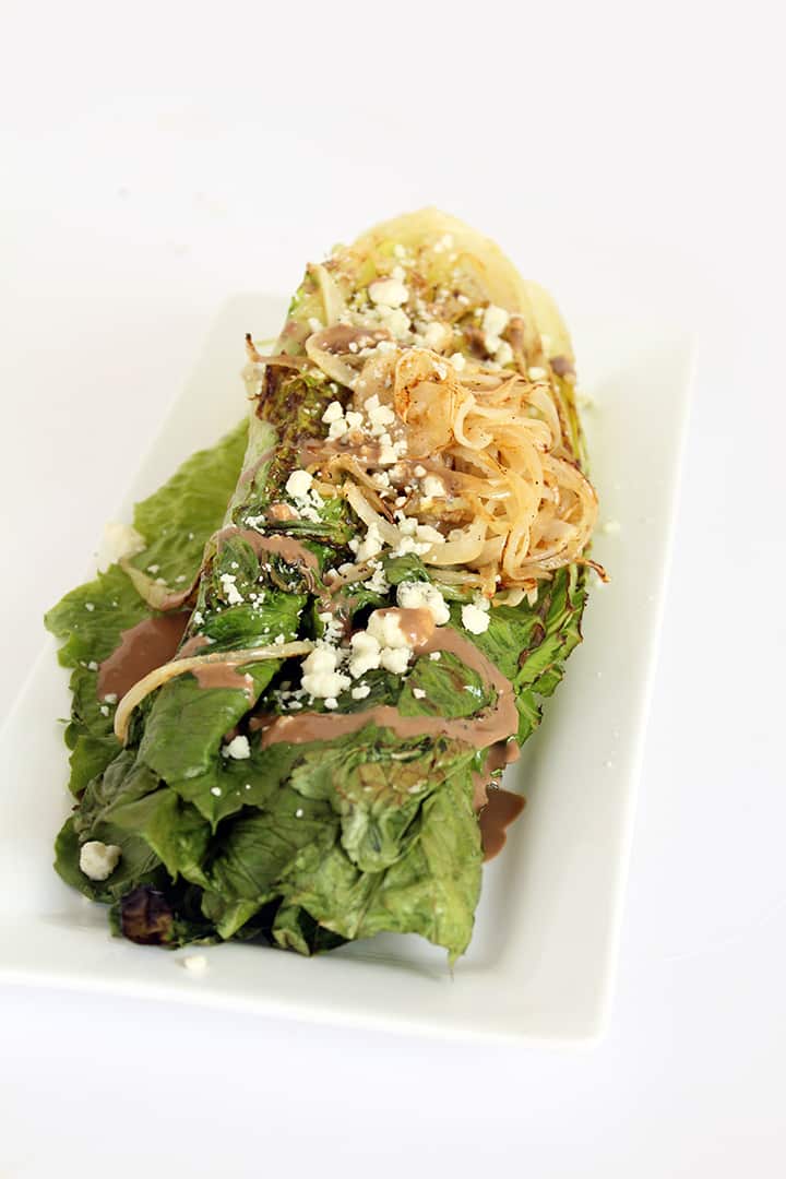 Grilled Romaine with Caramelized Onion Noodles, Blue Cheese and Greek Yogurt Balsamic Dressing