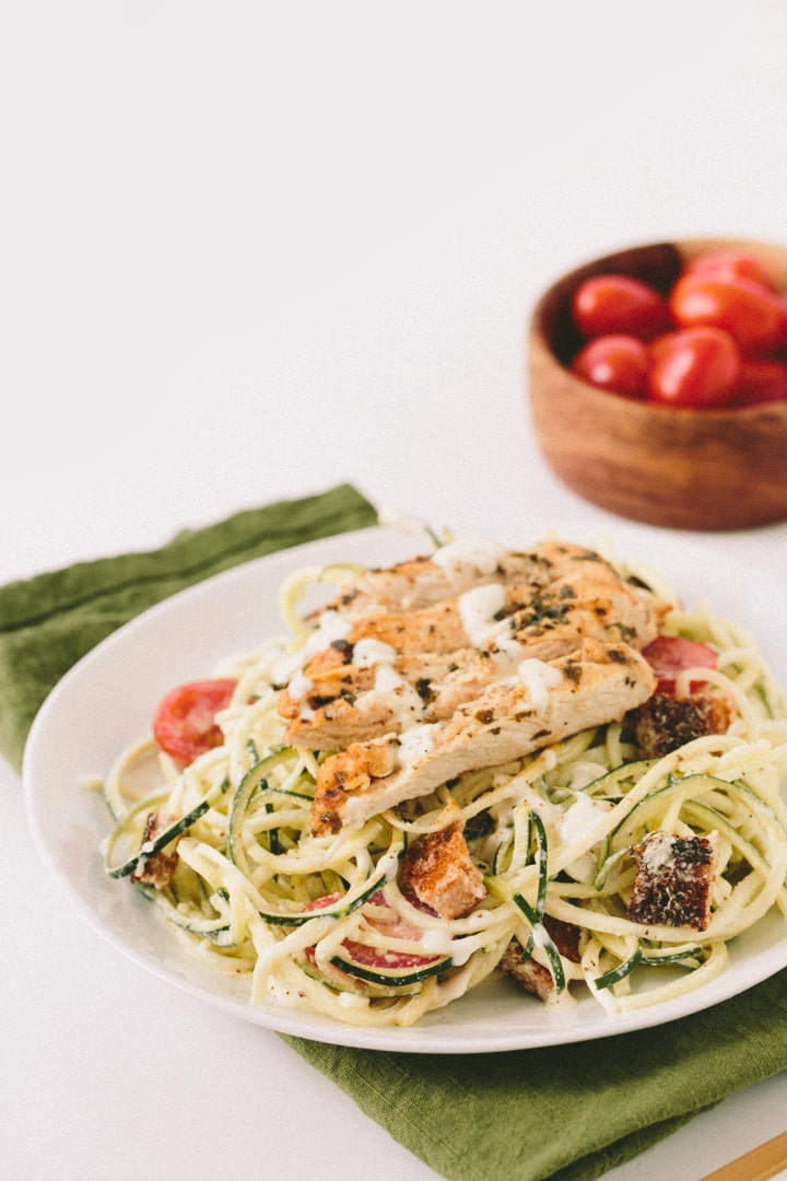 Gluten-Free Caesar Zucchini Noodles with Grilled Lemon Chicken, Tomatoes and Breadcrumbs