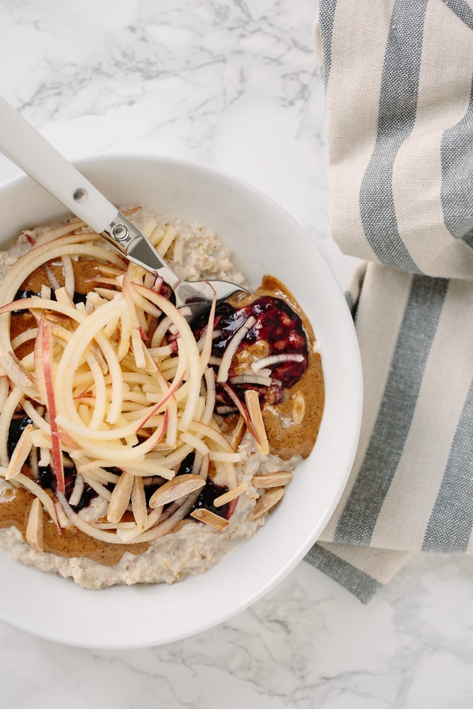 Almond Butter & Jelly Oatmeal Bowl with Spiralized Apples and Toasted Almonds