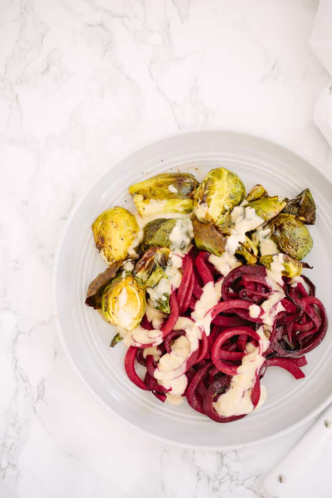 Balsamic Roasted Spiralized Beets with Brussels Sprouts and Hummus Dressing