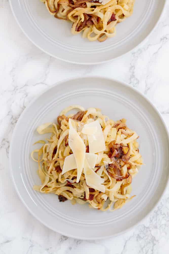 Caramelized Onion and Bacon Kohlrabi Spaghetti with Shaved Parmesan