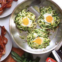 3 eggs in a pan with spiralized veggies from Foodie Crush.